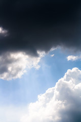 A rays of light shining throug dark clouds