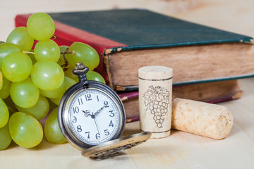 green grape and old pocket clock