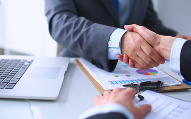 Business people shaking hands, finishing up a meeting