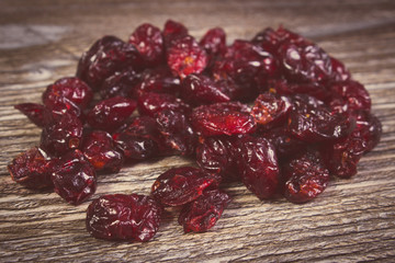 Vintage photo, Heap of red cranberries on wooden table