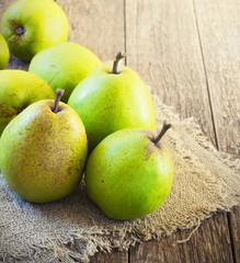 Pears on a rustic wooden kitchen table