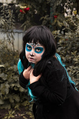 Girl in Halloween makeup - mexican Santa Muerte mask