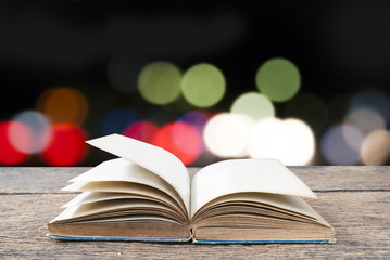 Open blank book with soft light outdoor background