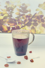 Tea and dried fruits in the window