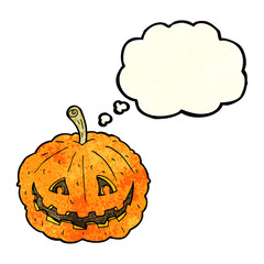 cartoon grinning pumpkin with thought bubble