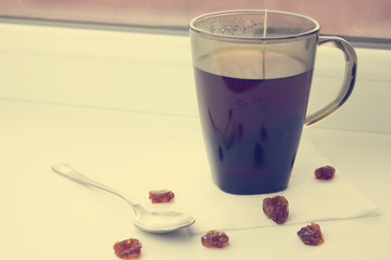 Tea and dried fruits in the window