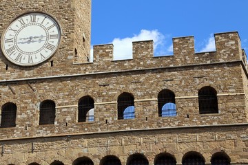 Fototapeta na wymiar Florence Italy Historic clock tower building called Palazzo Vecc