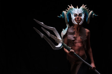 Fantasy concept of a young girl,strong brave warrior,wearing a helmet - mask with horns on head...