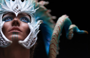 Fantasy concept of a young girl,strong brave warrior,wearing a helmet - mask with horns on head...