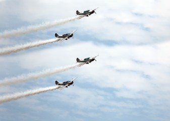 historic warplane with dark smoke from the engine malfunction