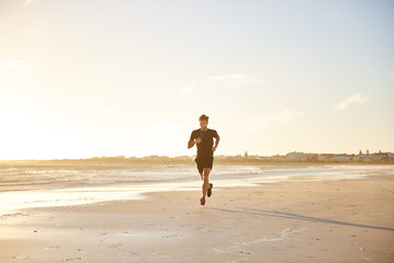 Ealry morning jogger on the beach