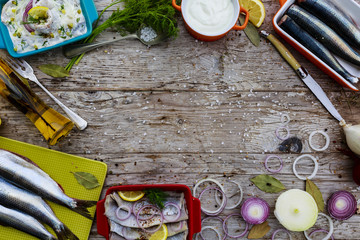 Herring - salad with cream, onion, dill-preparation background