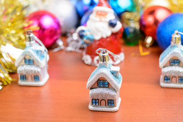 Christmas tinsel and toys on a wooden background