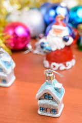 Christmas tinsel and toys on a wooden background