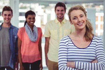 Happy creative team standing together