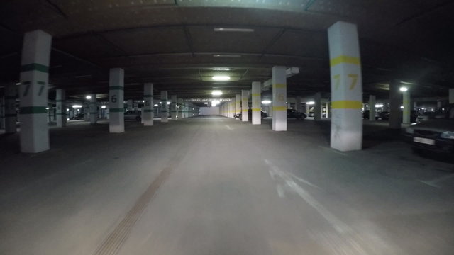 Pov drive through underground parking in shopping mall garage, real time. GoPro Hero 4 Black.