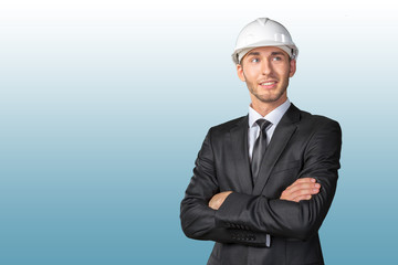 Young handsome engineer in white hardhat