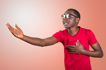 Young african man in glasses singing