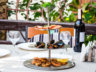 appetizer assorted seafood, prawns, mussels, calamari, wine