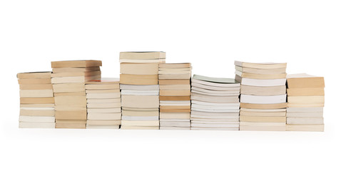 stacks of books in a row isolated on white background