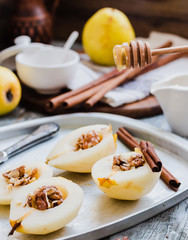add honey to a pear with walnuts, cinnamon sticks, cooking proce