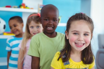 Happy kids standing in a line