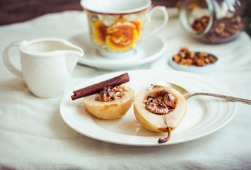 spicy baked pear with walnuts, honey, cinnamon sticks, healthy d
