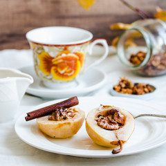 spicy baked pear with walnuts, honey, cinnamon sticks, healthy d