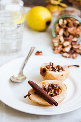 spicy baked pear with walnuts, honey, cinnamon sticks, healthy d