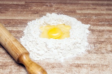 Broken egg on flour, means for making bread