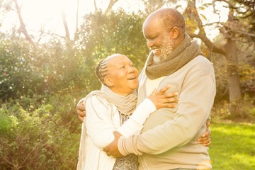 Happy peaceful senior couple embracing