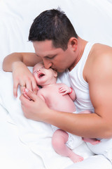 Obraz na płótnie Canvas Newborn baby sleeping on the shoulder of his father