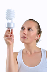 Beautiful young woman having an idea with holding an bulb