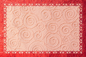 Shiny gold frame with a pattern on the foil background.
