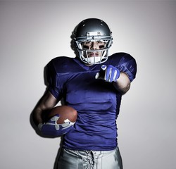 American football player pointing the camera
