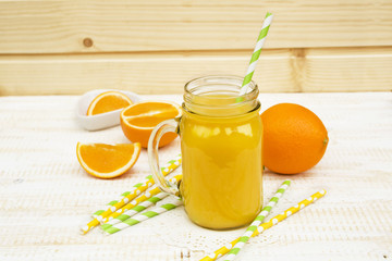 jar of juice and oranges