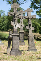 Old, abandoned stony Orthodox crosses