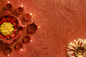 Diwali festival, Lighting of diya and decoration of flower surrounding a swan shaped flower pot