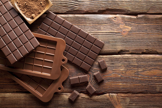 Chocolate on wooden wall background