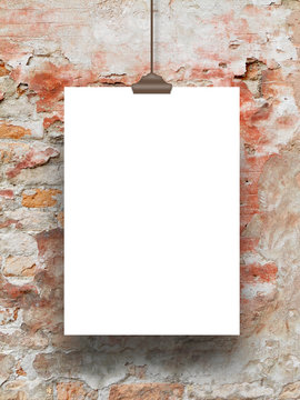 Vertical frame with clip on brick wall background