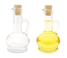 Oil in glass bottle and empty bottle