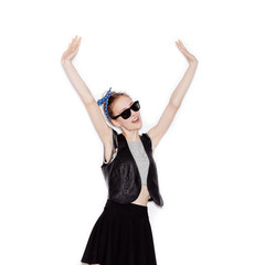 Girl with hands up laughing and dancing