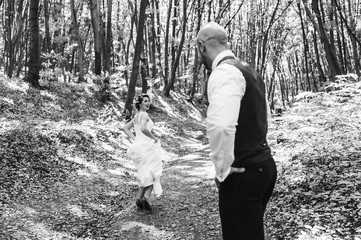 wedding, couple, forest walk. black and white photo