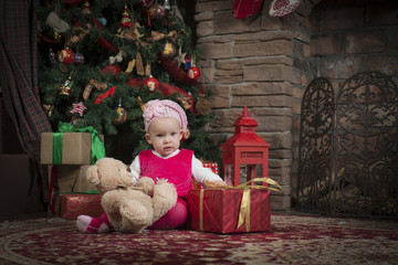 A little girl near the Christmas tree