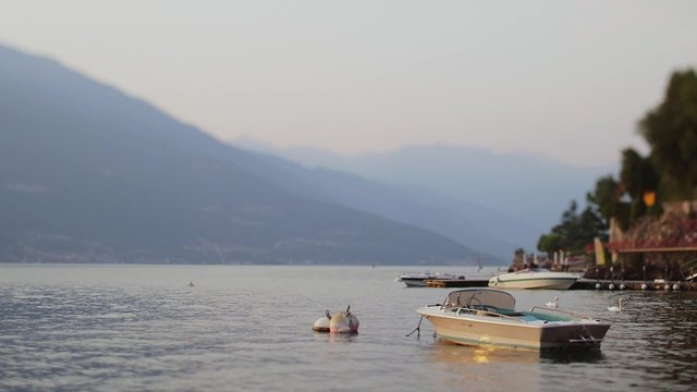 The beautiful shores of Lake Como and the Italian Alps in background. Sunset