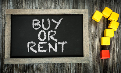 Buy or Rent? written on chalkboard
