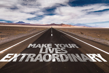 Make Your Lives Extraordinary written on desert road
