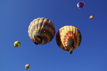 Balloons fill the air over wine vineyard during 2015 Temecula Balloon Festival in California