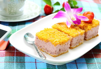 Gold Egg Yolk Thread Cakes on white plate and coffee.