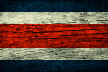 Vintage flag of Costa Rica on a wooden surface